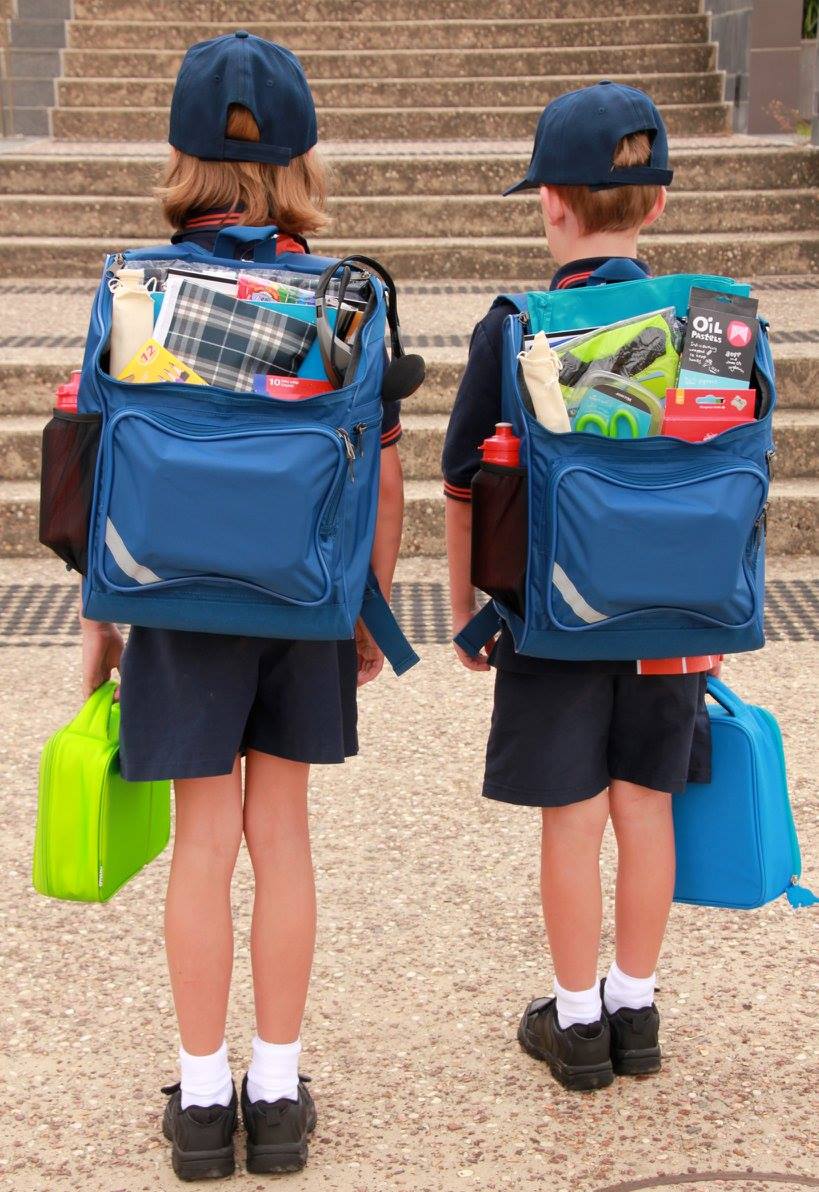 Two kids wearing backpacks